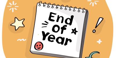 End of Year on notebook with orange background